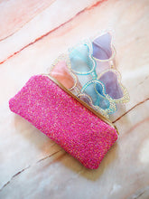 This hot pink glitter sunglasses case is handmade with a beige zip and a floral print cotton lining.