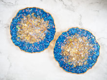 Give a new home owner a great gift with this set of Indigo Geode Heatproof Resin Coasters that has been handmade by Suki Sabur.
