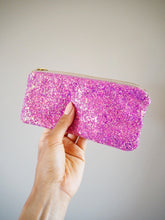 This hot pink glitter glasses case has a shimmer of blue, purple, and gold.