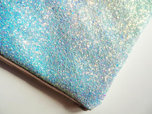 This handmade sparkly pastel blue clutch bag is made by Suki Sabur and is a limited edition colour that looks great with pastel colours for a wedding or special occasion.