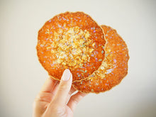 This Set of Handmade Resin Coasters is handmade with a shimmering orange pigment and heatproof epoxy resin.