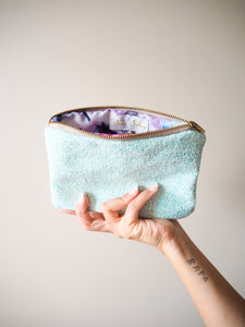 This handmade lagoon blue glitter makeup bag has a cotton lining that is made from 100% cotton with a gorgeous floral print.