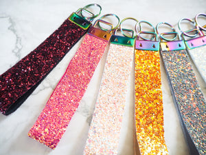 This handmade glitter wristlet strap keyring can hold multiple keys on the rainbow split ring.