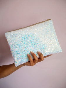 white iridescent glitter clutch that's perfect as a wedding bag